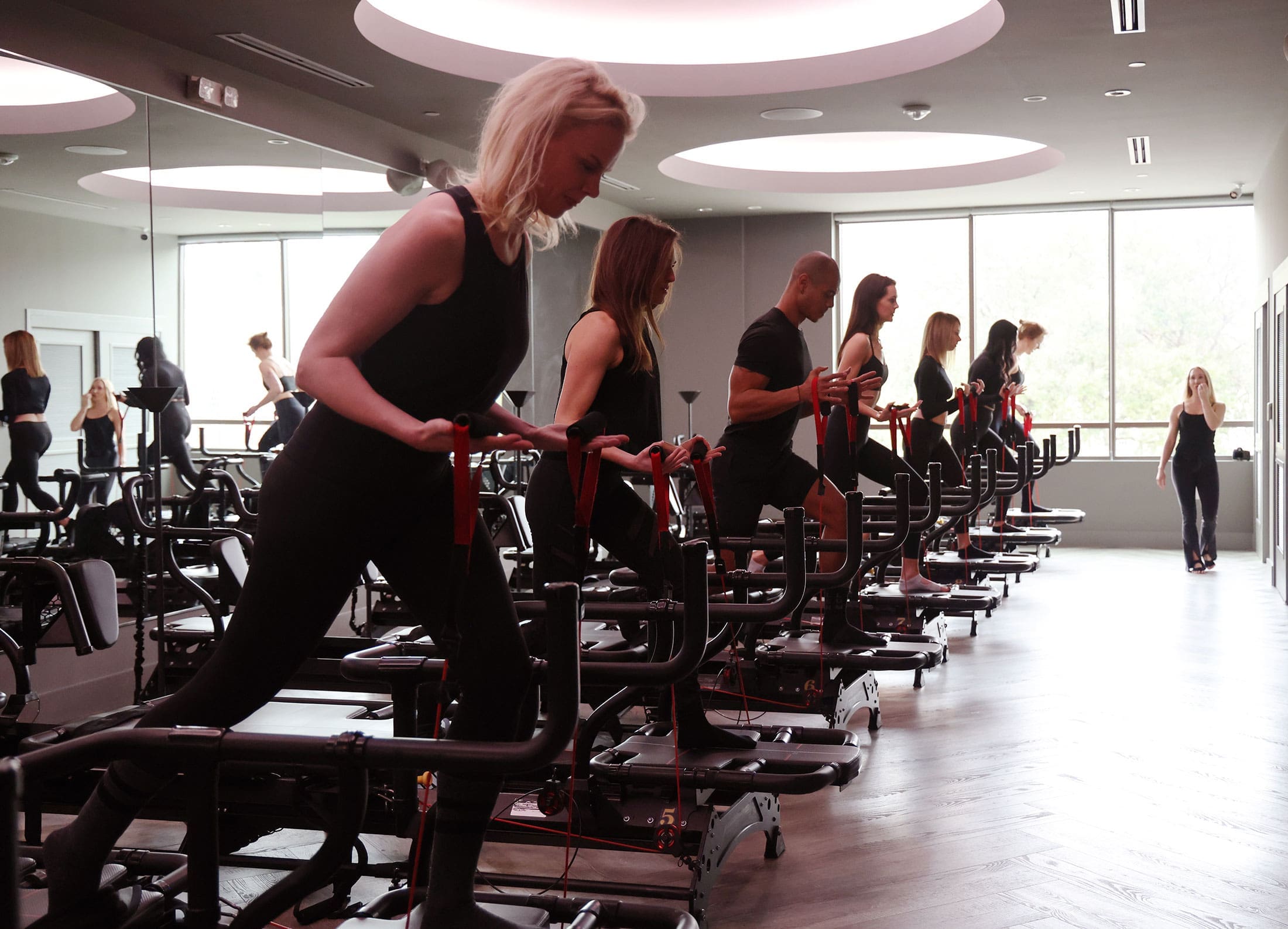 book-now-featured Ladies working out during a Lagree class at TIGHT Dallas.